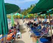 Welcome to this virtual tour of Kamala Beach, one of the most beautiful beaches on the island of Phuket, Thailand.&#60;br/&#62;As we walk along the white sand beach, the crystal clear waters of the Andaman Sea lap at our feet. We can see the stunning views of the lush tropical greenery that surrounds the beach, creating a peaceful and calming atmosphere.&#60;br/&#62;The beach is lined with many small shops and restaurants where you can enjoy some of the best Thai cuisine. You can relax under the shade of the beach umbrellas, or soak up the sun on the beach chairs.